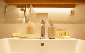 a bathroom sink with a faucet and a mirror at Locanda del Delta in Comacchio