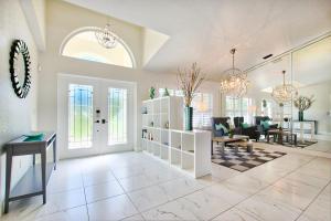 a large living room with a table and chairs at VILLA FOUR PALMS - 3 BEDS - 2 BATHS - 6 GUESTS - GULF ACCESS & POOL - INCL.10% OFF BOAT RENTAL in Cape Coral