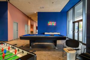 a billiard room with a pool table and foosballs at CX Venice Mestre in Mestre