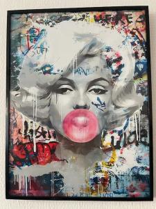 a painting of a woman with a pink tongue at LE POP ART Studio-Proche tram in Gaillard