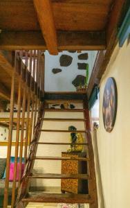 a staircase in a room with wooden ceilings at Casa Lola in Los Realejos