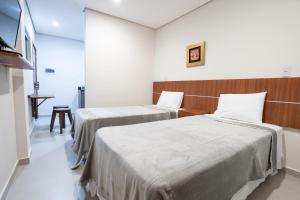 Ліжко або ліжка в номері VIVARIUM APART HOTEL