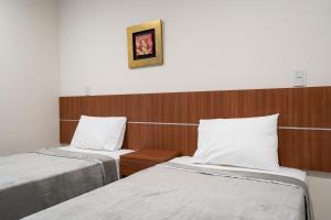 Ліжко або ліжка в номері VIVARIUM APART HOTEL