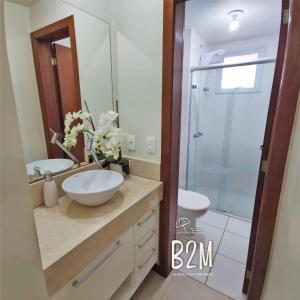 a bathroom with a sink and a shower at Beto Carrero, vista Espetacular do mar, Home Club in Penha
