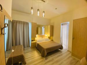 a hotel room with a bed and a window at Hotel Butterfly Wellness & Spa in Rimini