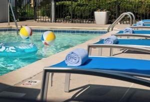 a swimming pool with volley balls in the water at TownePlace Suites by Marriott Findlay in Findlay