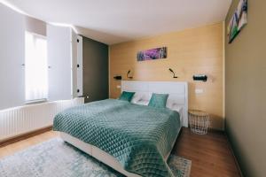 Postel nebo postele na pokoji v ubytování Hotel De Kalvaar