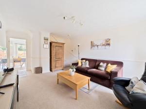 a living room with a couch and a coffee table at Pass the Keys Cosy 2BR Home in Walton in Walton-on-Thames