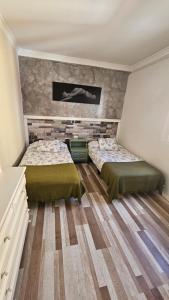 Postel nebo postele na pokoji v ubytování Apartamentos GARAKOTA