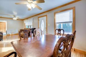a dining room with a wooden table and chairs at Pet-Friendly New Egypt Home with Fenced Pool and Grill in Cookstown