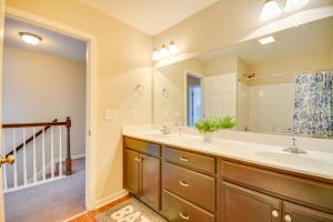 a bathroom with two sinks and a large mirror at 4 Mi to HPU Pet-Friendly Home with Yard! in High Point +26 photos