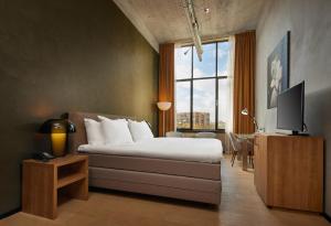 TV a/nebo společenská místnost v ubytování WestCord Hotel Eindhoven