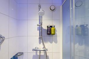 a shower in a bathroom with a shower at Holiday Inn Express Ramsgate – Minster by IHG in Minster