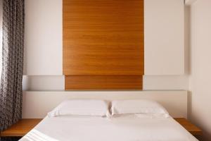 Postel nebo postele na pokoji v ubytování Precise House Montaperti Siena