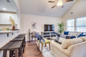 a living room with a couch and a table at Family Home Near Downtown and Convention Center! in Savannah