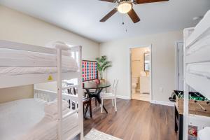 a bedroom with bunk beds and a dining room with a table at Family Home Near Downtown and Convention Center! in Savannah