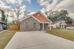 a brick house with an orange roof and a driveway at Family Home Near Downtown and Convention Center! in Savannah
