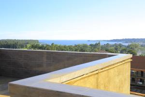 a view of the ocean from the roof of a building at AIRPORT HOTEL Entebbe in Entebbe