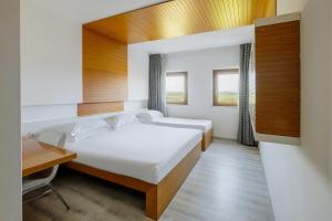 Postel nebo postele na pokoji v ubytování Precise House Montaperti Siena