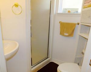 a bathroom with a shower and a toilet and a sink at Venture Out 79 Gulf Loop Comes With Golf Cart in Panama City Beach +16 photos