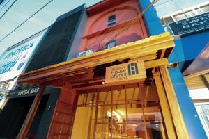 a sign on the front of a building at House Of Jars in Vientiane