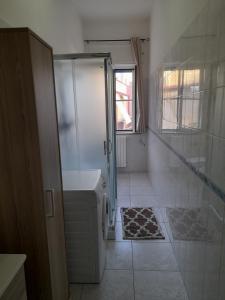 a bathroom with a shower and a toilet and a sink at Casa Brezza marina in Barletta +13 photos