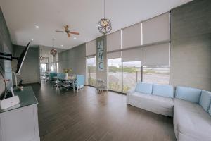 a large living room with a couch and a table at Mar y campo Casa Huarca in La Isla