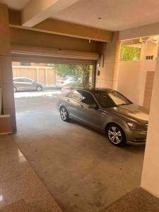 a car parked inside of a garage at Ban Luxury Apartments in Al Khobar