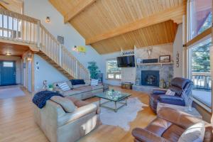 a large living room with couches and a fireplace at Spacious Angel Fire Retreat 3 Mi to Ski Resort in Angel Fire
