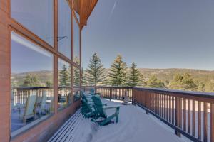a balcony with chairs and a view of the mountains at Spacious Angel Fire Retreat 3 Mi to Ski Resort in Angel Fire