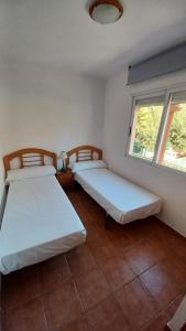 Giường trong phòng chung tại Les Villes Orangecosta
