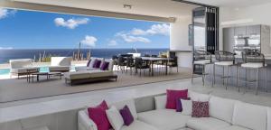 a living room with a view of the ocean at Villa Regatta in Kralendijk
