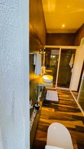 a bathroom with a sink and a toilet at 8 Plus Motels in Negombo