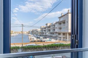 a view from a window of a marina at 405-Casa al canal con amarre in Empuriabrava