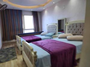 A bed or beds in a room at Amazing Sea View 2 bedroom apartment