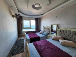 A bed or beds in a room at Amazing Sea View 2 bedroom apartment