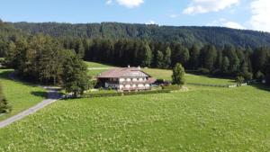 an aerial view of a large house in a field at Schöpfer Hof - Urlaub beim Biobauer in Rasun di Sopra