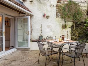 a table and chairs sitting on a patio at 3 bed in Braunton 85884 in Barnstaple