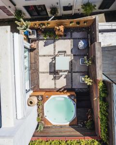 an overhead view of a bath tub on a patio at Le Grenier Luxury Loft in Franschhoek