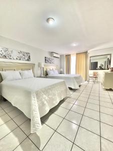 Postel nebo postele na pokoji v ubytování Gran Hotel Paris