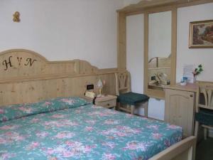 Postel nebo postele na pokoji v ubytování Hotel Negritella