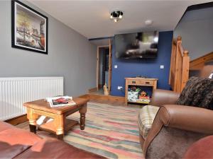 a living room with a couch and a coffee table at 2 bed property in Ammanford 87025 in Llandybie