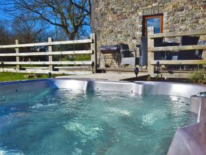 a plunge pool in a yard with a fence at 2 bed property in Ammanford 87025 in Llandybie