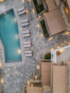 an overhead view of a pool in a building at Galazio Suites, Serifos in Livadakia