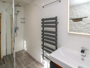 a bathroom with a sink and a shower at Ty Len in Haverfordwest