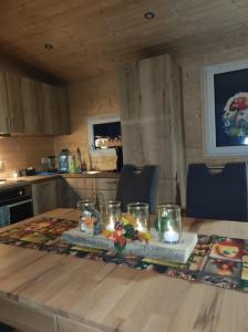 a table in a kitchen with lights on it at Unser Großer - Tiny House 