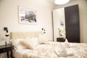 מיטה או מיטות בחדר ב-Piazza Testaccio Home appartamento E 2 Accogliente e Silenzioso