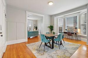 a dining room with a table and chairs at 2BR Bright and Lovely Apt - Leland 3 in Chicago