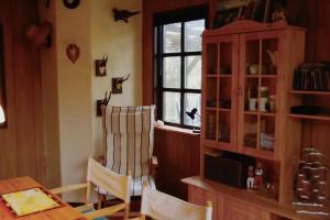 a dining room with a table and a chair at Piraten Nest in Schortens