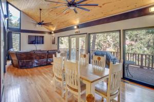 a dining room with a table and chairs at Ruidoso Cabin Retreat with Multi-Level Deck in Ruidoso